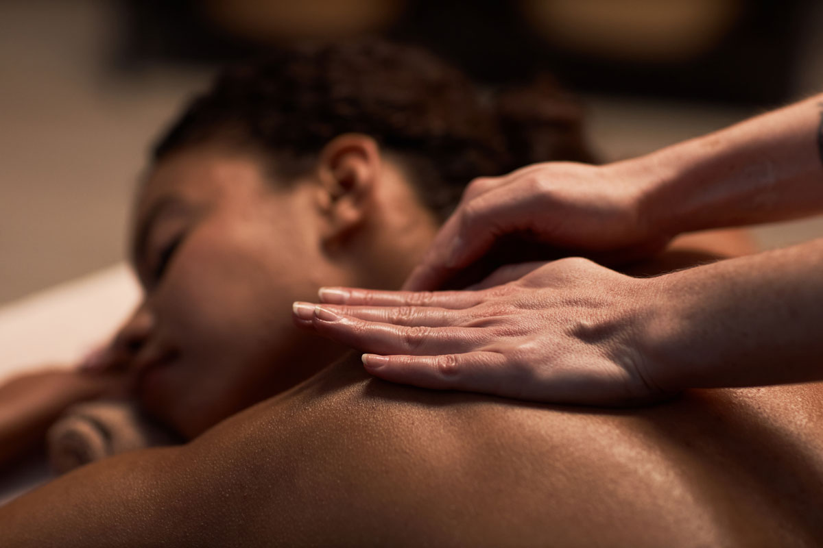 massaging-neck-of-female-in-New-Port-Richey-Florida-Massage-Therapy- Lymphatic Drainage